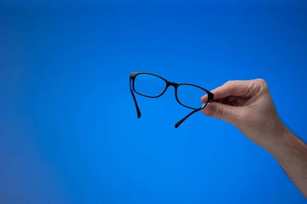 Moldura Plástico Preto Óculos Vidro Transparente Realizada Pela Mão Masculina — Fotografia de Stock