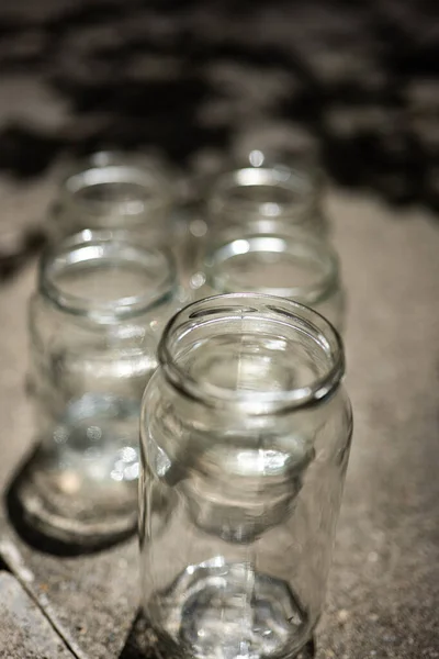 Various Size Shape Empty Glass Jars Lids Set Ground Pavement — 图库照片