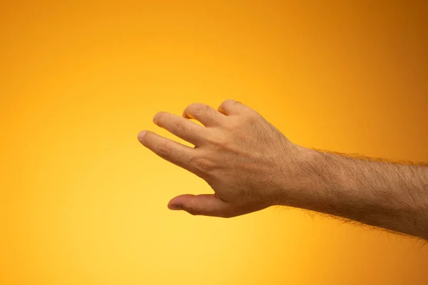 Open Caucasian Male Hand Close Studio Shot Isolated Orange Background — Fotografia de Stock