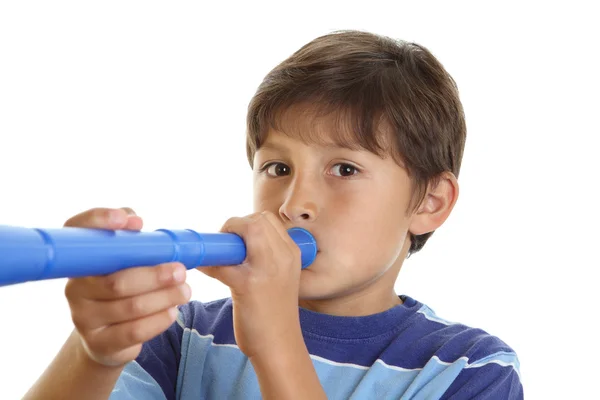 Boy blowing blue horn — Stock Photo, Image