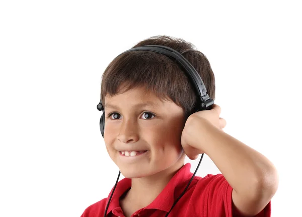 Joven niño feliz escuchando los auriculares —  Fotos de Stock