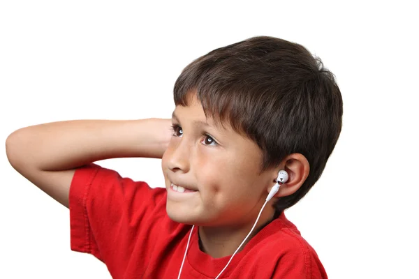 Young boy listens to music on headphones — Stock Photo, Image