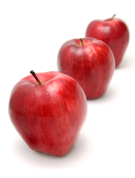 Three organic red delicious apples — Stock Photo, Image