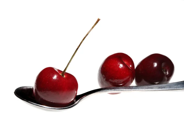 Cherries on spoon — Stock Photo, Image