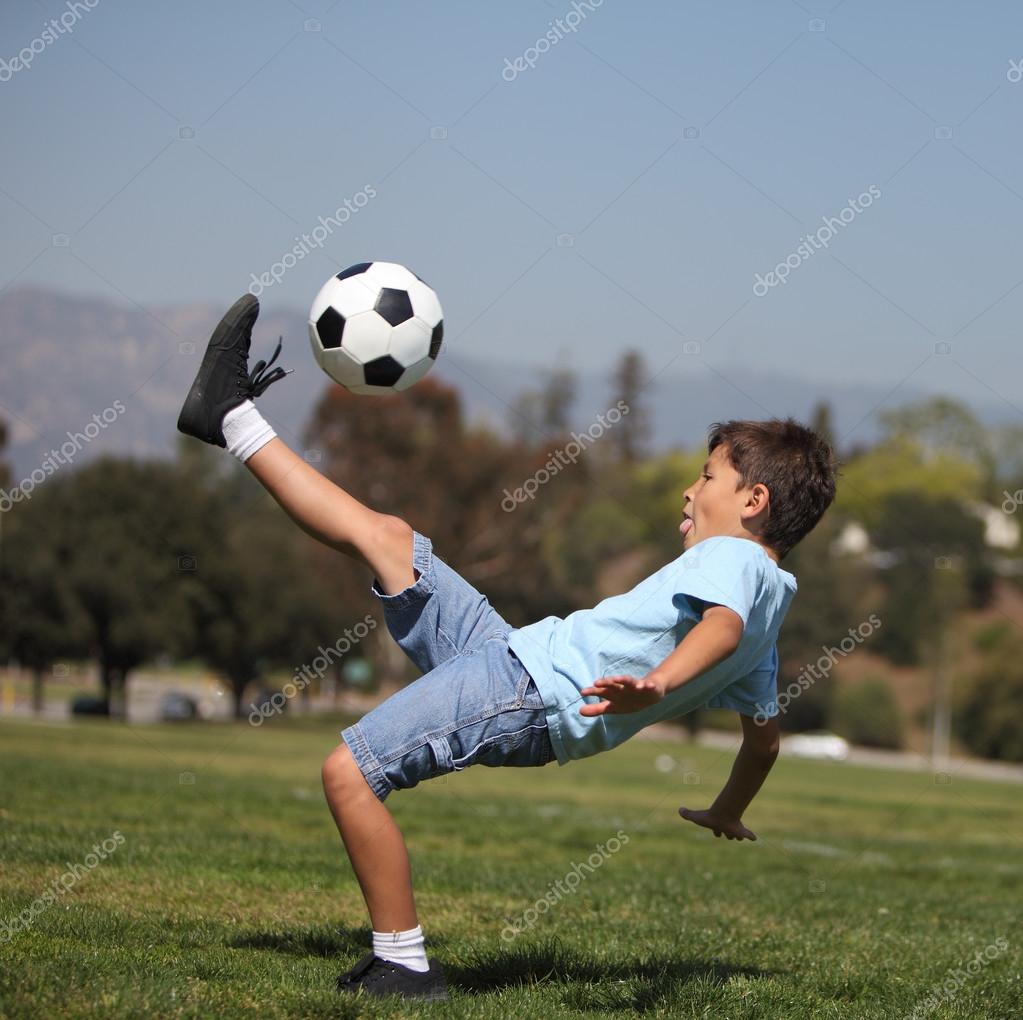 Boy kicking soccer ball — Stock Photo © dmediapro 12171496