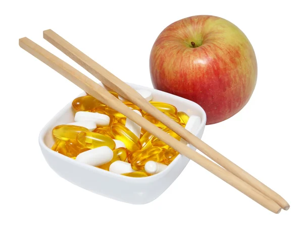 Apple with vitamin pills — Stock Photo, Image