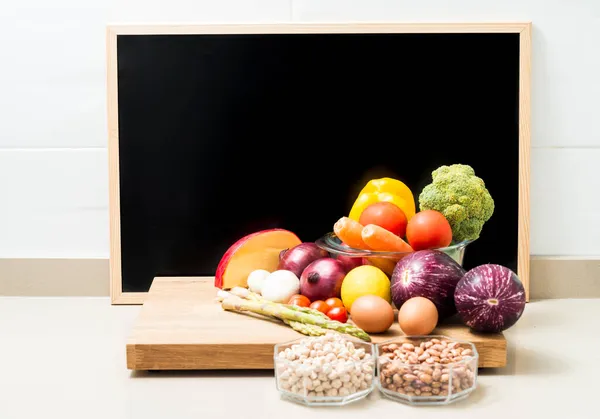 Still life with healthy food and a blackboard with space for copying. Conceptual image about healthy food diets. Copy space.