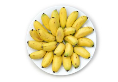 On the plate delicious little bananas isolated on white clipart