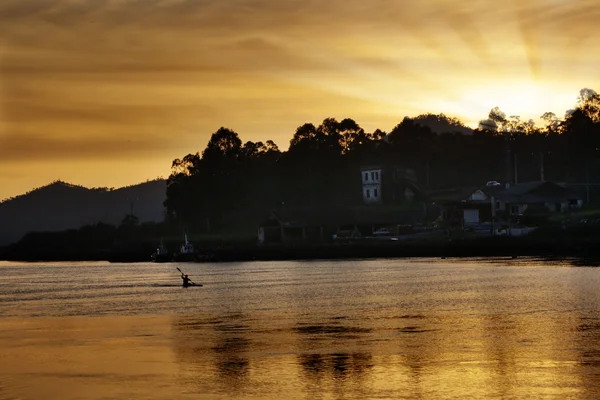 Canoeing at sunset — Stock Photo, Image