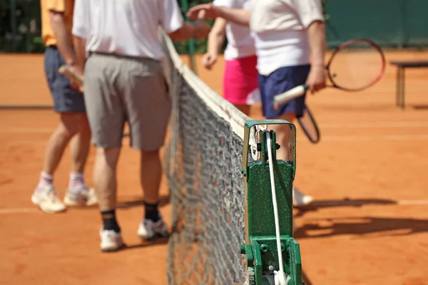 Mixed nelinpeli tennispelaajat — kuvapankkivalokuva