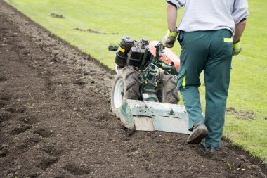 Man with rototiller clipart