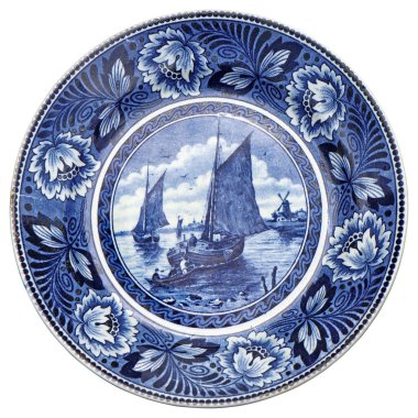 Old Blue and white ceramic plate with Dutch motifs as a souvenir