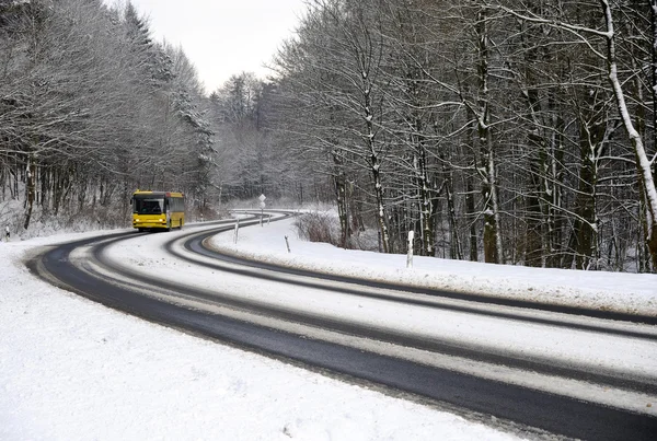 Winter road with bus — Stock Photo, Image