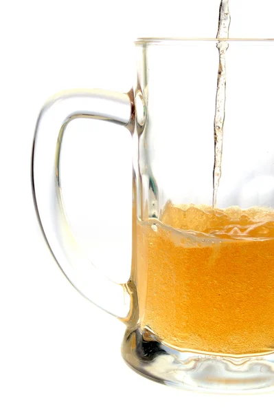 Pouring beer into mug in white background — Stock Photo, Image