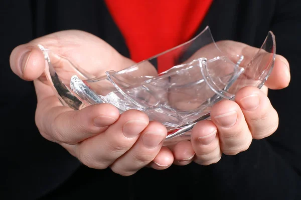 Broken glass in hand — Stock Photo, Image