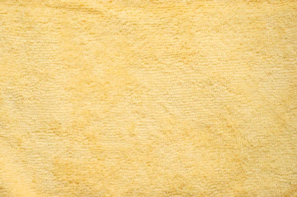 Towel, yellow background — Stock Photo, Image