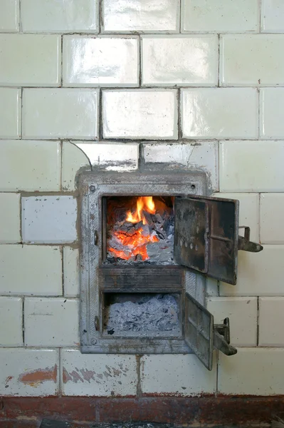 Old fireplace and door, stove, fire — Stock Photo, Image