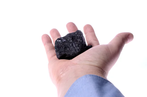 Stukken van steenkool in palm. bedrijf kolen. — Stockfoto