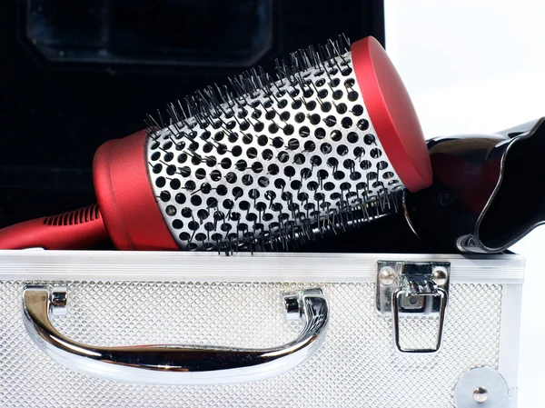 Red round comb, case and hairdryer — Stock Photo, Image