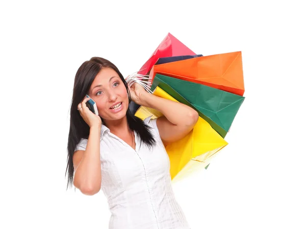 Portrait cute young woman mobile phone while holding shopping ba — Stock Photo, Image