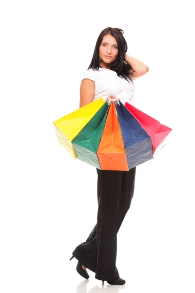 Full body portrait cheerful businesswoman holding shopping bags — Stock Photo, Image