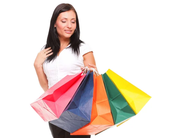 Portrait cheerful businesswoman holding shopping bags — Stock Photo, Image