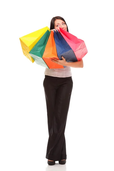 Corpo inteiro retrato alegre empresária segurando sacos de compras — Fotografia de Stock