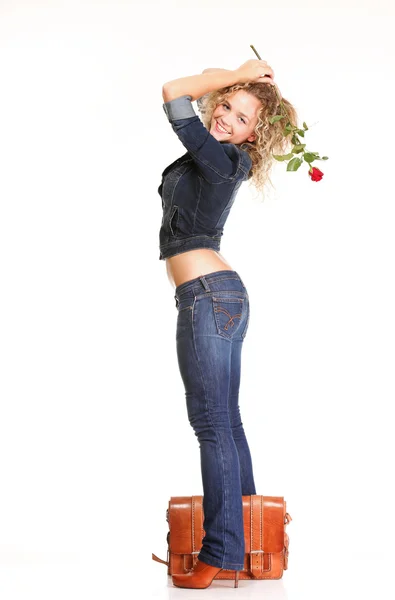 Beautiful young woman blonde in jeans romantic red rose isolated — Stock Photo, Image