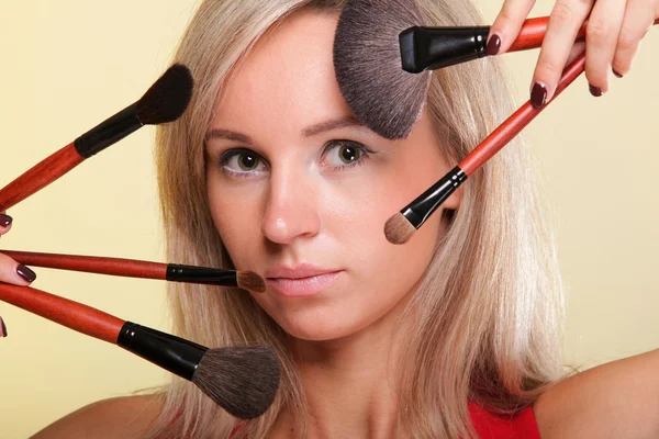 Beautiful young woman make-up brush yellow — Stock Photo, Image