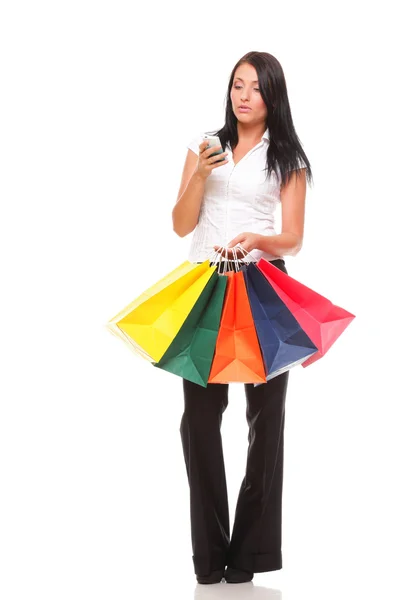 Portrait cute young woman mobile phone while holding shopping ba — Stock Photo, Image