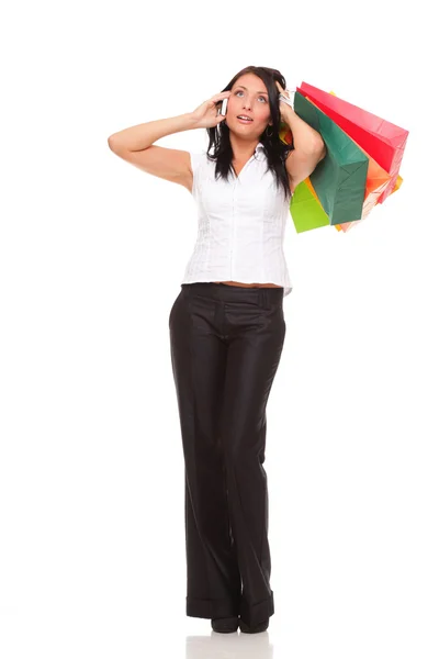 Portrait cute young woman mobile phone while holding shopping ba — Stock Photo, Image