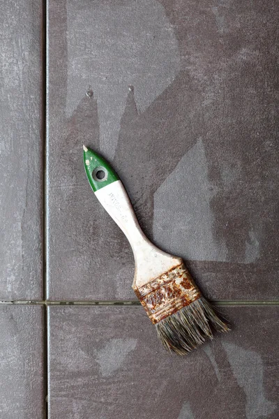 Construction brush tiling at home tile floor adhesive — Stock Photo, Image