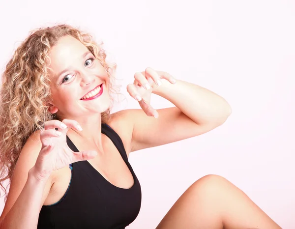 Beautiful long blond curly hair of young attractive woman — Stock Photo, Image