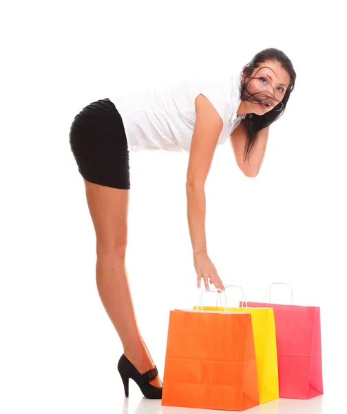 Full length of happy young lady shopping bags against isolated — Stock Photo, Image