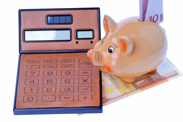 Piggy bank, rekenmachine en euro 's — Stockfoto