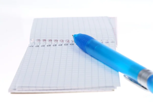 Empty page of notebook and blue ballpoint — Stock Photo, Image