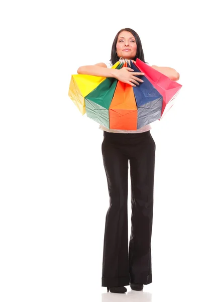 Full body portrait cheerful businesswoman holding shopping bags — Stock Photo, Image