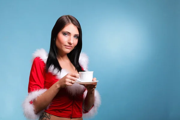Beautiful girl santa claus Girl blowing hot drink — Stock Photo, Image