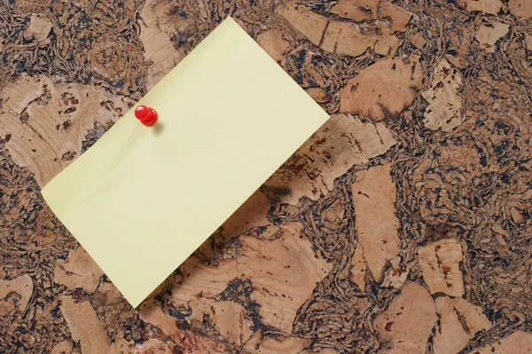 Paper clip and push pin on cork noticeboard — Stock Photo, Image