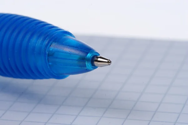 Empty page of notebook and blue ballpoint — Stock Photo, Image