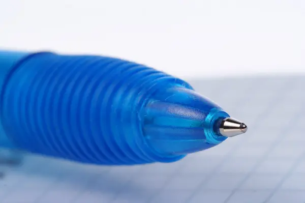 Empty page of notebook and blue ballpoint — Stock Photo, Image