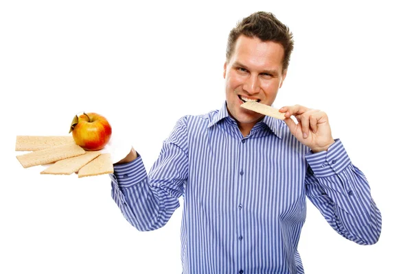 Healthy lifestyle man eating crispbread and apple — Stock Photo, Image