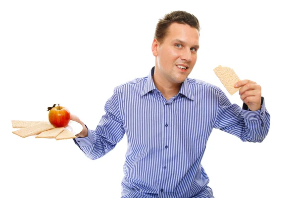 Healthy lifestyle man eating crispbread and apple — Stock Photo, Image