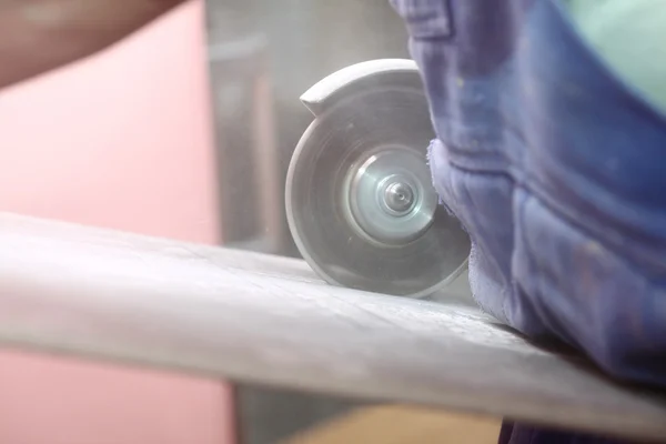 Grinder worker cuts a stone the electric tool — Stock Photo, Image