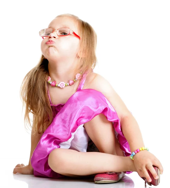 A cute girl puffs up her cheeks isolated — Stock Photo, Image