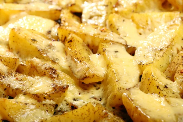 Roasted potatoes with spices and cheese — Stock Photo, Image