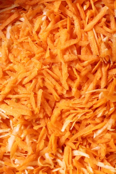 Grated carrots vegetables salad as background — Stock Photo, Image
