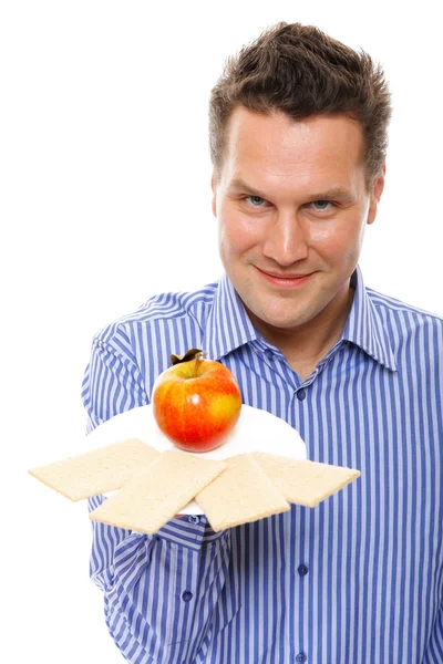 Estilo de vida saludable hombre comiendo pan crujiente y manzana — Foto de Stock