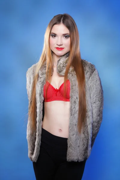 Sexy woman in fur coat and red bra — Stock Photo, Image