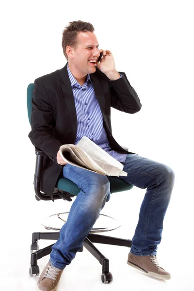 Man looks surprised while reading a newspaper — Stock Photo, Image